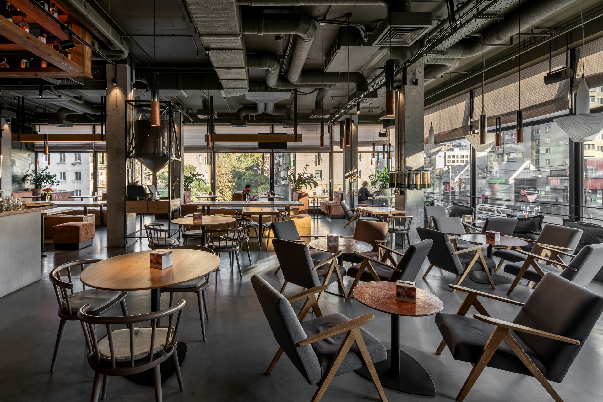 Interior of modern cafe in loft style with flexible seating mix
