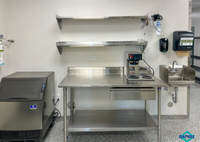 St. Joan of Arc project - Prep Area: Manitowoc Self Contained Ice Machine, Prep Table, Coffee Brewer, Wall Shelves, T&S Hand Sink