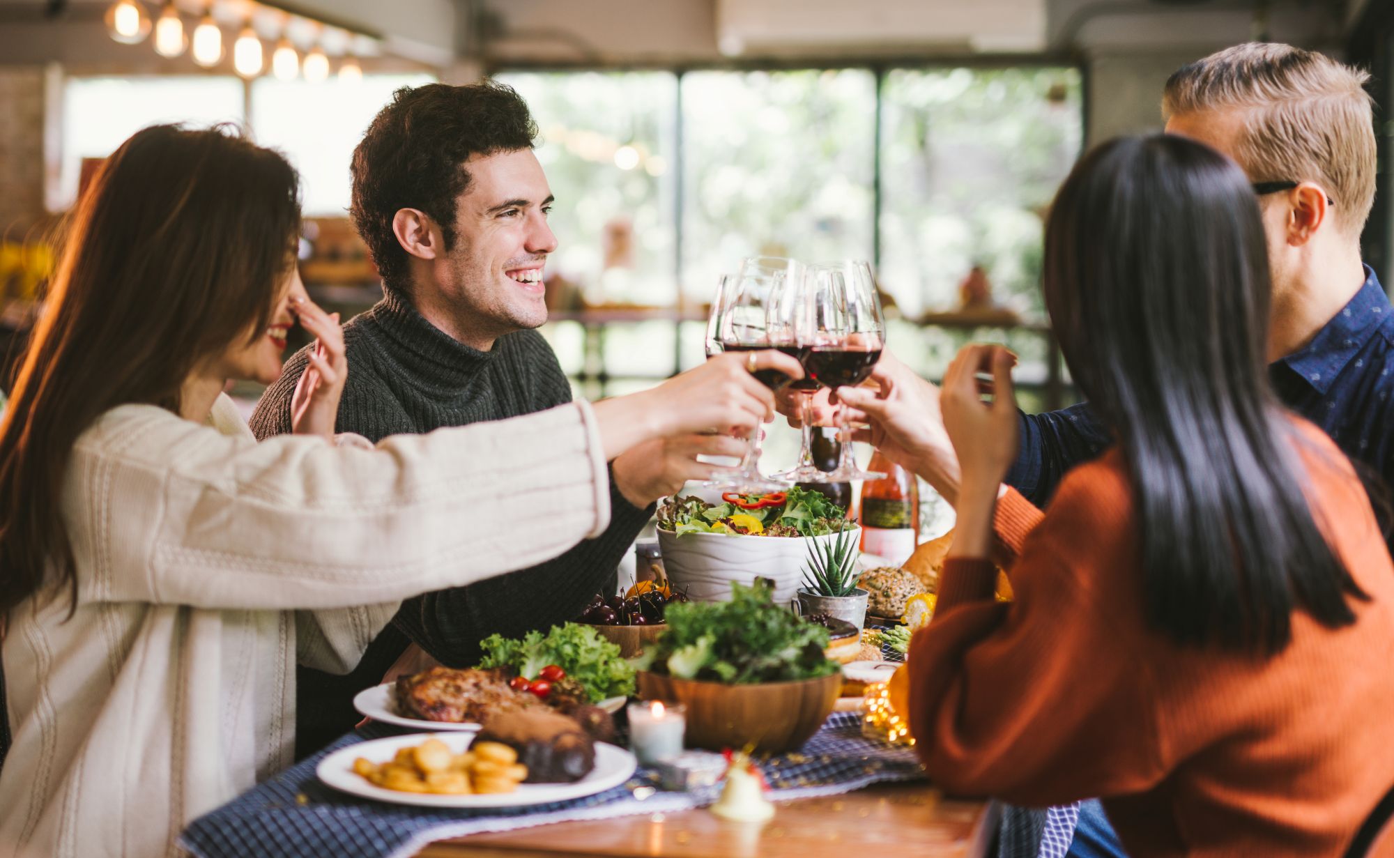 Friendsgiving Dinner with friends - Dining Wine Cheers Party thanksgiving Concept