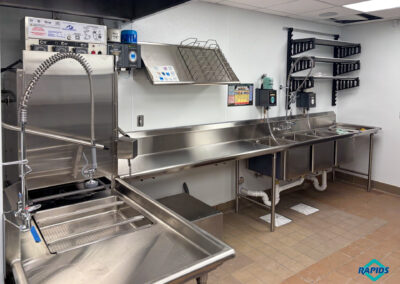 Warewashing Area: Door Type Dishawasher, Soiled Table with Overshelf, Clean Table with 3-Compartment Sink, Drying Rack