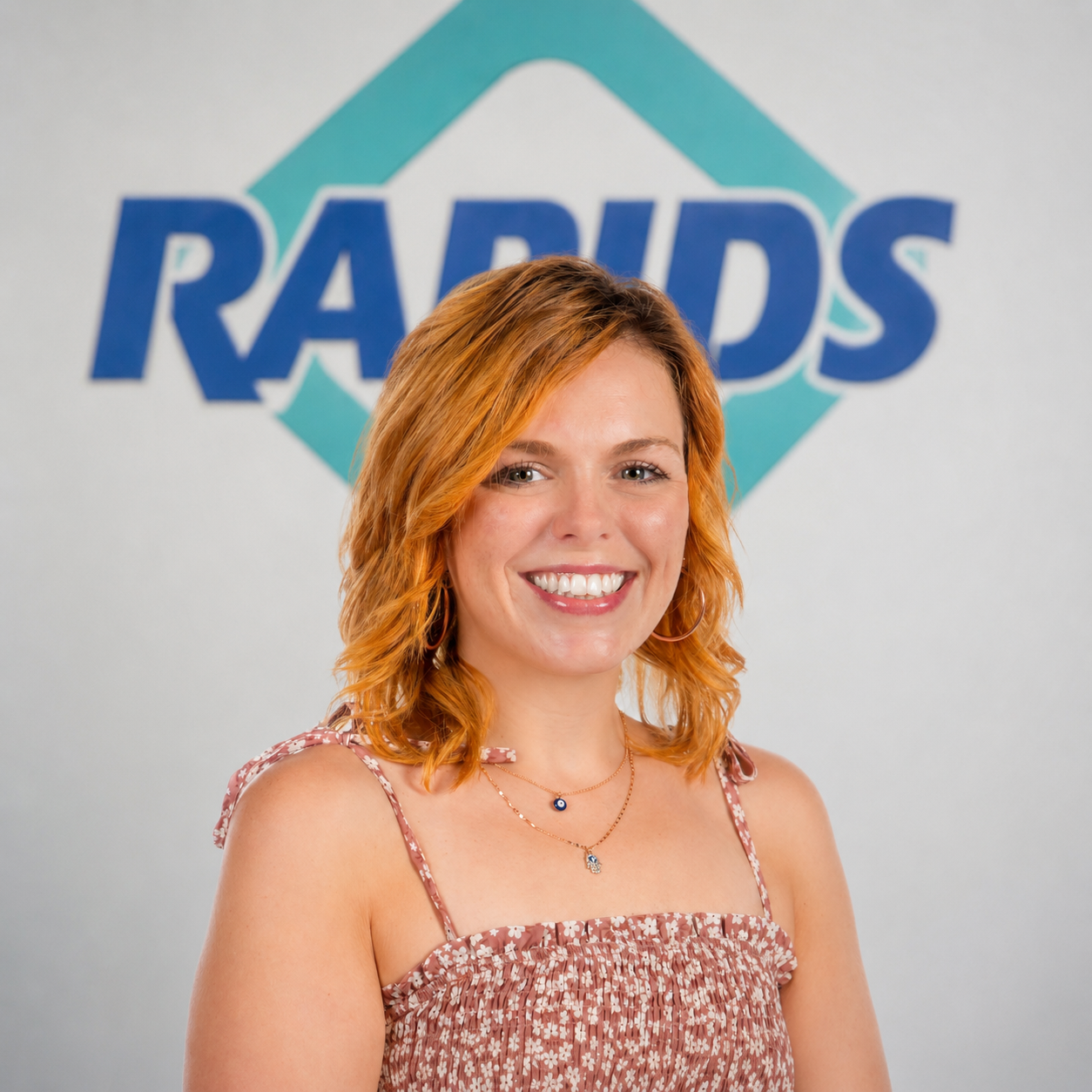 Tanya Larson with Rapids logo behind