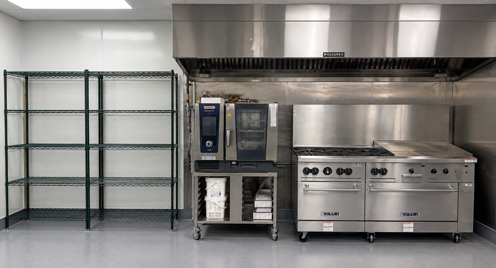 Finished commercial kitchen cookline with installed stainless steel equipment including range, oven, and shelving